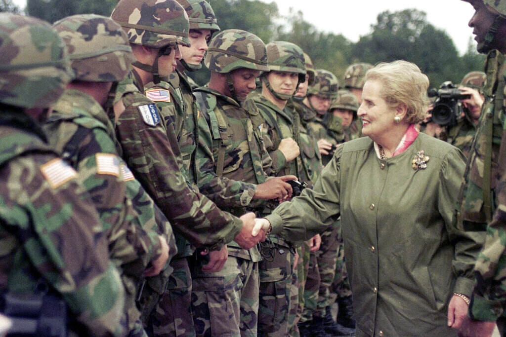 Obit Albright U.S. Secretary of State Madeleine Albright shakes hands with U.S. soldiers during her visit to Air Base Eagle near Tuzla, Aug, 30, 1998. Albright has died of cancer, her family said Wednesday, March 23, 2022.(AP Photo/Amel Emric, File)