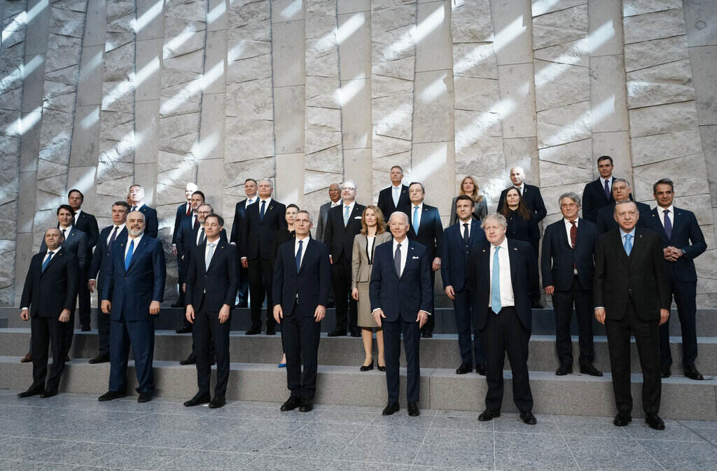 Belgium Russia Ukraine War Summit NATO heads of state pose for a group photo during an extraordinary NATO summit at NATO headquarters in Brussels, Thursday, March 24, 2022. As the war in Ukraine grinds into a second month, President Joe Biden and Western allies are gathering to chart a path to ramp up pressure on Russian President Vladimir Putin while tending to the economic and security fallout that's spreading across Europe and the world. (AP Photo/Thibault Camus)