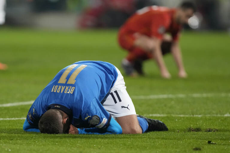 Italy's Domenico Berardi drops to his knees after missing a scoring chance during the World Cup qualifying play-off soccer match between Italy and North Macedonia, at Renzo Barbera stadium, in Palermo, Italy, Thursday, March 24, 2022. (AP Photo/Antonio Calanni)