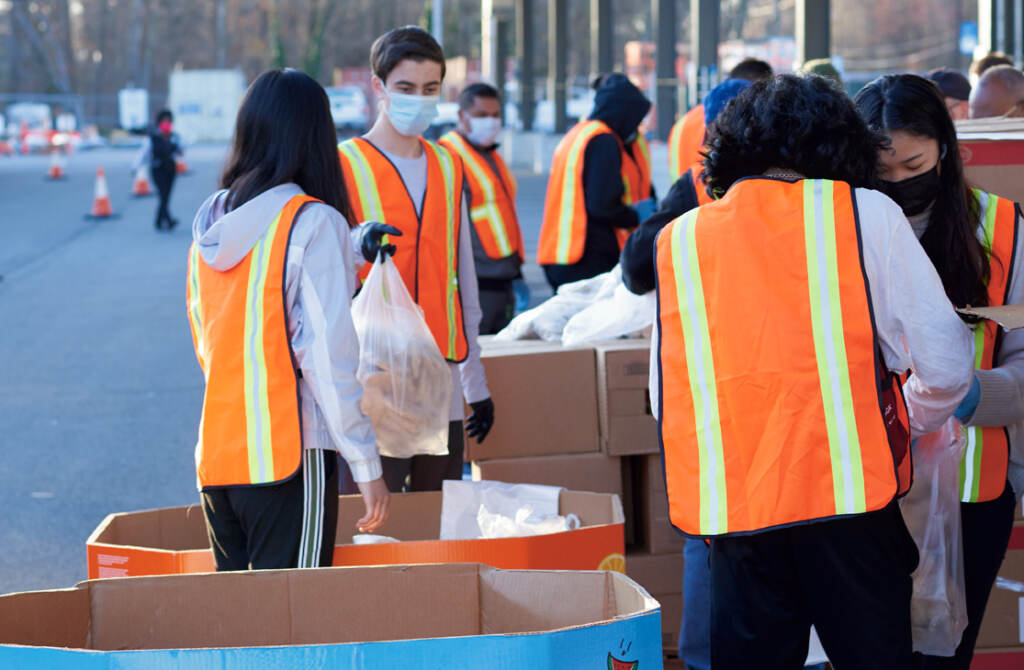 Food-Bank-of-South-Jersey-1 Workers at the Food Bank of South Jersey load food for distribution
