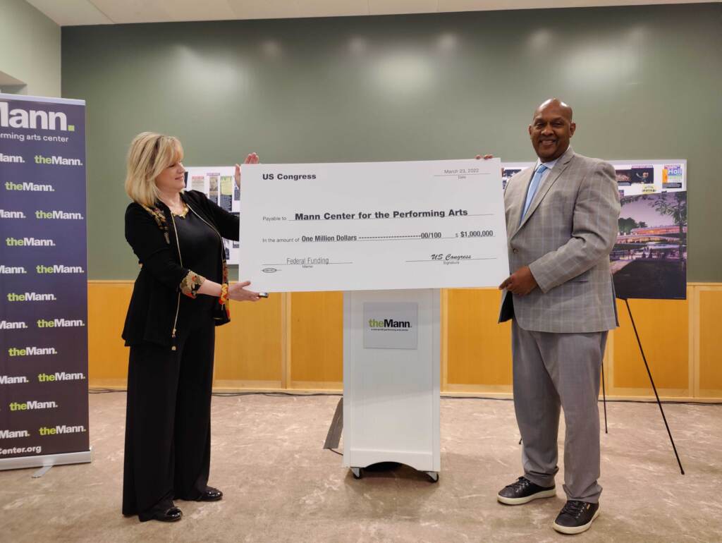 Mann Center CEO Catherine Cahill and Congressman Dwight Evans, March 23, 2022 Catherine Cahill, CEO of the Mann Center, receiving $1 million in federal funding from Congressman Dwight Evans. (Peter Crimmins/WHYY)