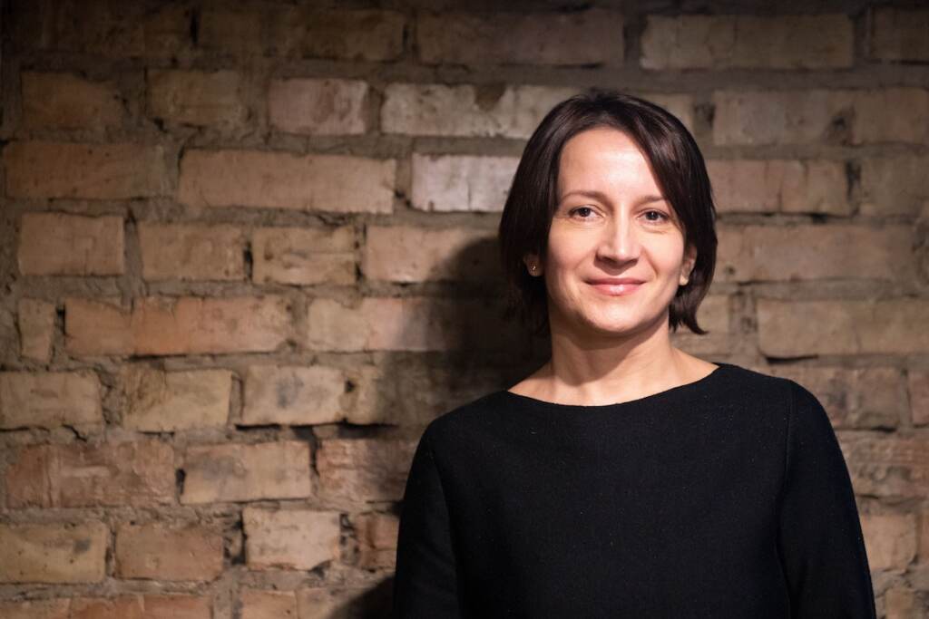 Natal’ya Vorozhbit Ukrainian playwright Natal'ya Vorozhbit poses in a black shirt, in front of a brick wall.