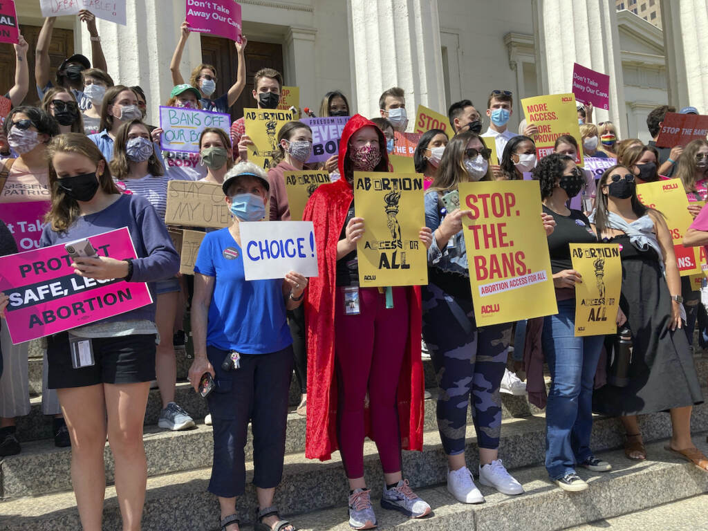 Abortion Missouri Abortion rights protesters gather outside a courthouse holding signs