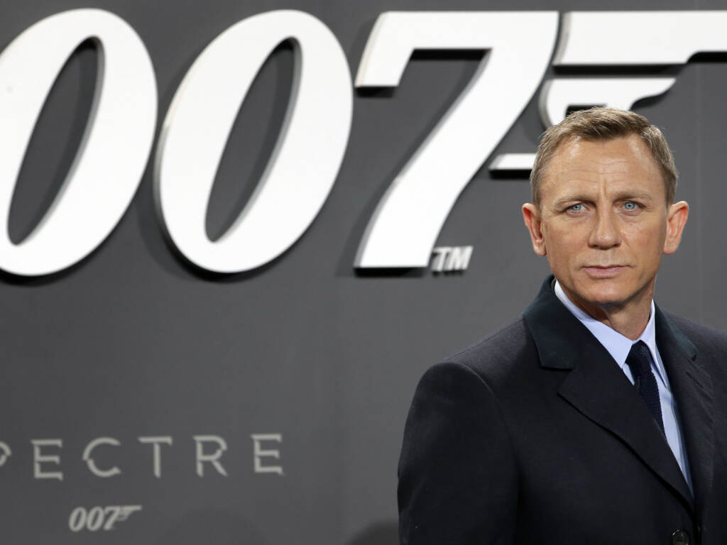 The nearly $8.5 billion merger deal between Amazon and MGM is official. MGM is the movie and TV studio behind the James Bond franchise, Legally Blonde and other popular films. FILE - In this Oct. 28, 2015, file photo, actor Daniel Craig poses for the media as he arrives for the German premiere of the James Bond movie 'Spectre' in Berlin, Germany. Amazon, on Wednesday, May 26, 2021, is buying MGM, the movie and TV studio behind James Bond, “Legally Blonde” and “Shark Tank,” with the hopes of filling its video streaming service with more stuff to watch