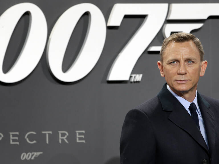FILE - In this Oct. 28, 2015, file photo, actor Daniel Craig poses for the media as he arrives for the German premiere of the James Bond movie 'Spectre' in Berlin, Germany. Amazon, on Wednesday, May 26, 2021, is buying MGM, the movie and TV studio behind James Bond, “Legally Blonde” and “Shark Tank,” with the hopes of filling its video streaming service with more stuff to watch