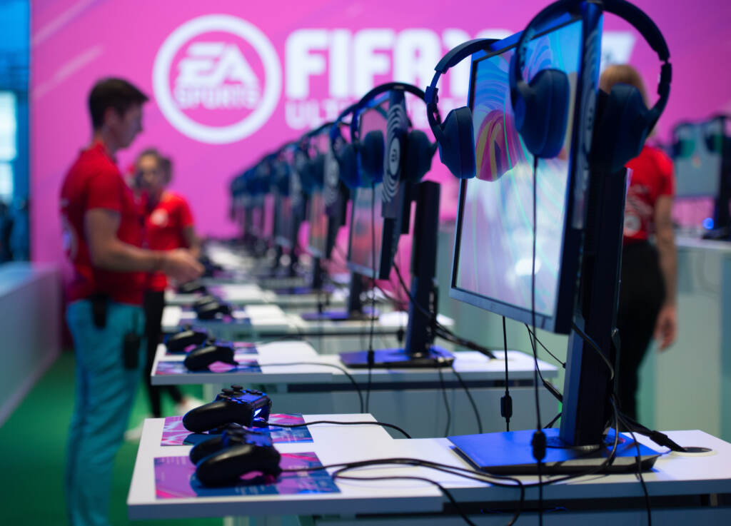Gaming consoles where visitors can try out the “Fifa 19” video game are seen at the booth of EA Sports during the Gamescom convention in 2019 in Cologne, Germany. Gaming consoles where visitors can try out the