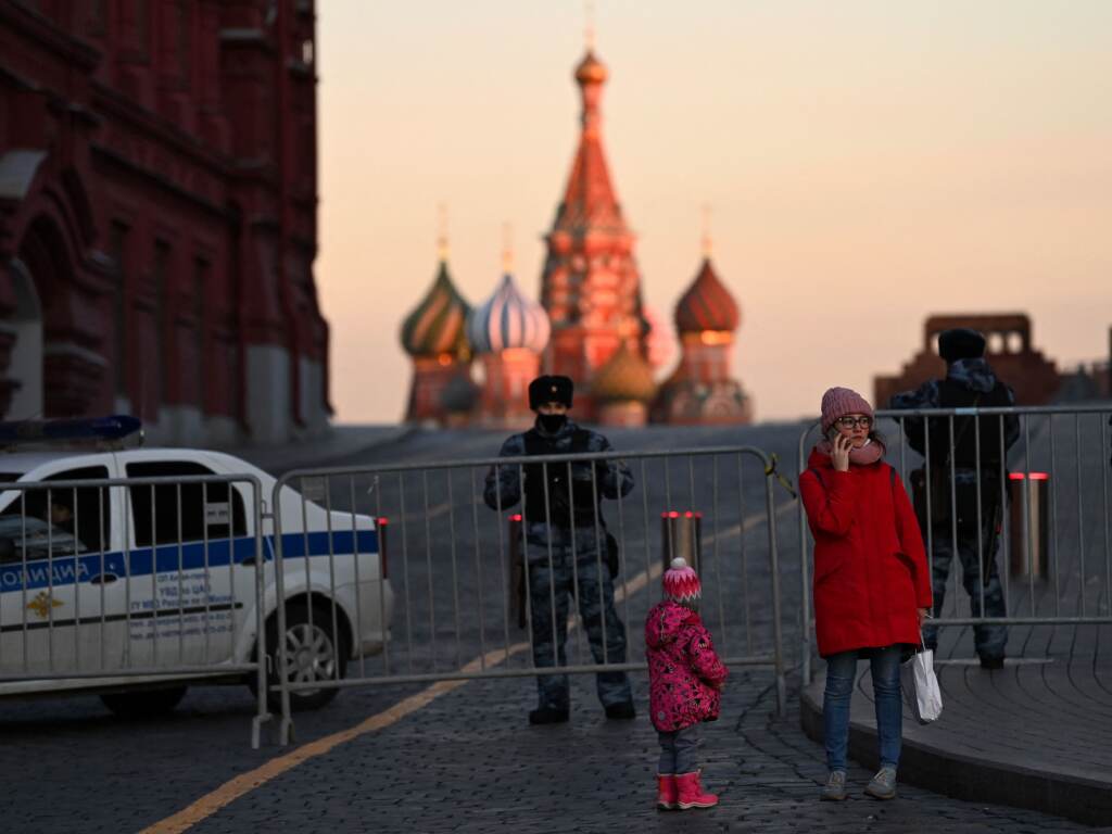 A woman makes a phone call in front of police officers blocking access to Red Square in central Moscow on March 2, 2022 A woman makes a phone call in front of police officers blocking access to Red Square in central Moscow on March 2, 2022 (Kirill Kudryavtsev/AFP via Getty Images)