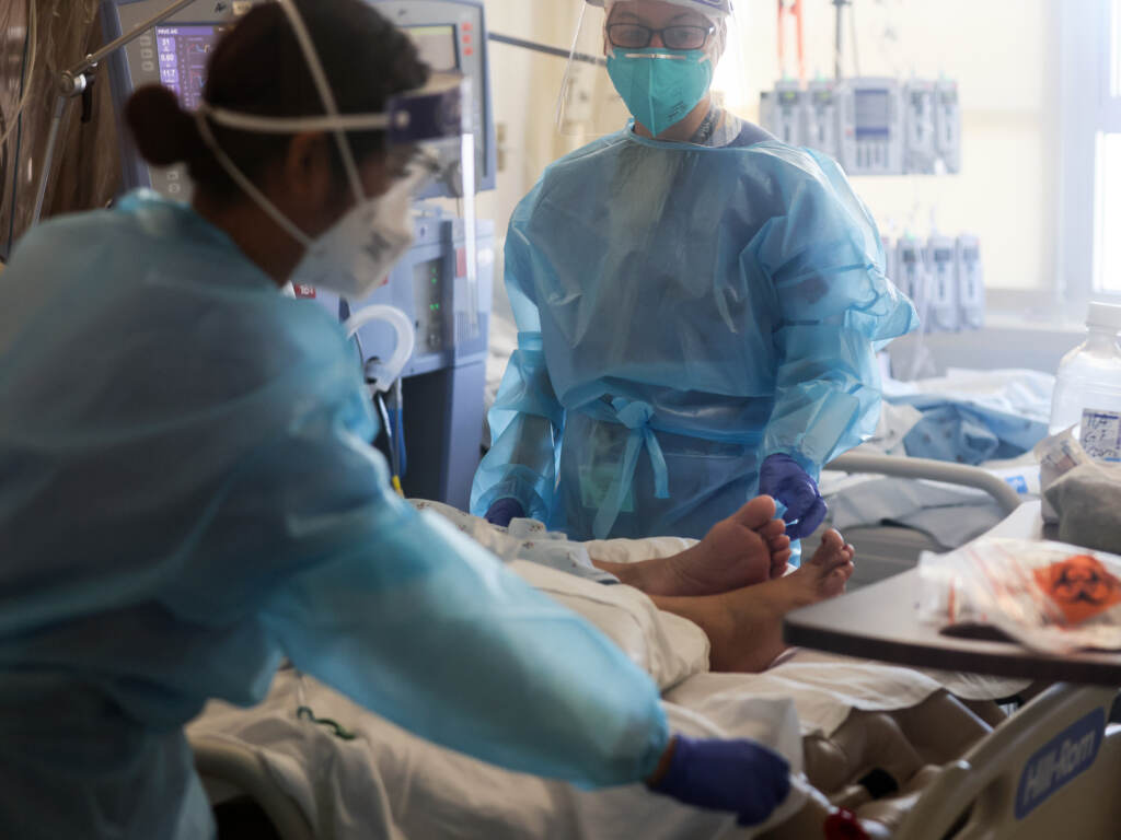 Healthcare workers care for COVID-19 patients in a makeshift ICU at Harbor-UCLA Medical Center on Jan. 21, 2021, in Torrance, Calif. Healthcare workers care for COVID-19 patients in a makeshift ICU at Harbor-UCLA Medical Center on Jan. 21, 2021, in Torrance, Calif. (Mario Tama/Getty Images)