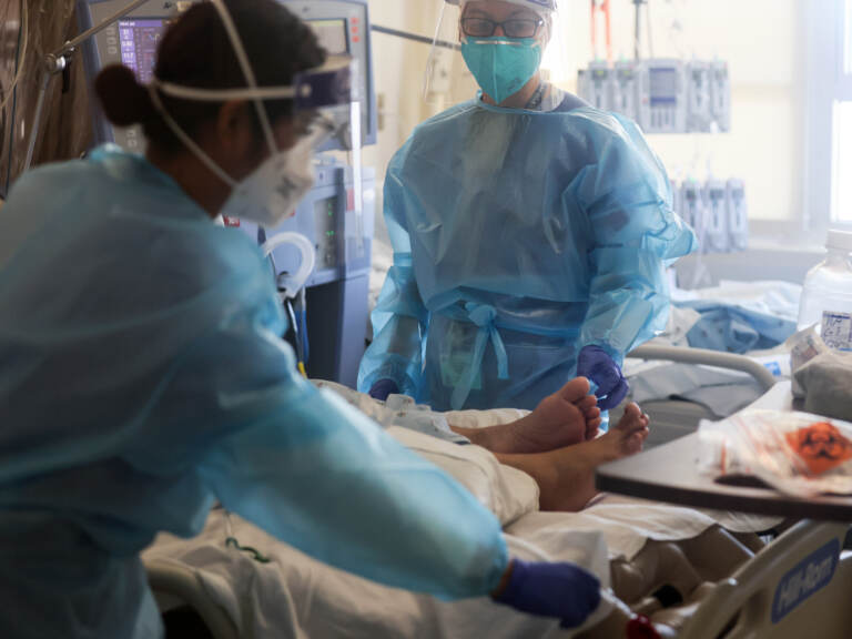 Healthcare workers care for COVID-19 patients in a makeshift ICU at Harbor-UCLA Medical Center on Jan. 21, 2021, in Torrance, Calif. (Mario Tama/Getty Images)