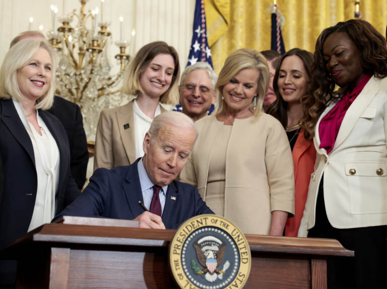 President Joe Biden signs the Ending Forced Arbitration of Sexual Assault and Sexual Harassment Act of 2021 into law on Thursday. (Anna Moneymaker/Getty Images)