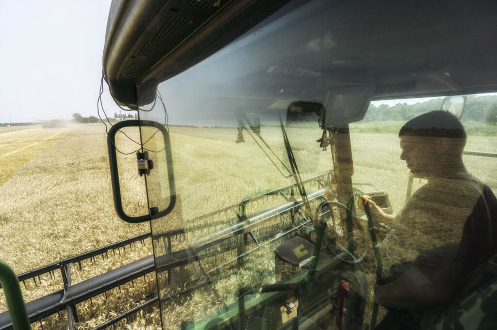 A driver sits in the cab of a combine harvester during the summer harvest in a field of wheat in Varva, Ukraine. Ukraine accounts for more than 10% of the global wheat market. Russia’s war threatens to disrupt the spring planting season. A driver sits in the cab of a combine harvester during the summer harvest in a field of wheat in Varva, Ukraine. Ukraine accounts for more than 10% of the global wheat market. Russia's war threatens to disrupt the spring planting season. (Vincent Mundy/Bloomberg via Getty Images)