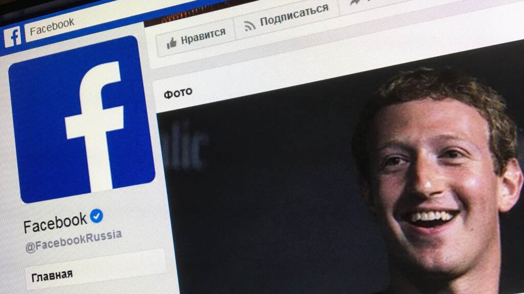 A picture taken in Moscow in March 2018 shows the Russian language version of Facebook’s “about” page, featuring the face of founder and CEO Mark Zuckerberg. A picture taken in Moscow on March 22, 2018 shows an illustration picture of the Russian language version of Facebook about page featuring the face of founder and CEO Mark Zuckerberg. (Mladen Antonov/AFP via Getty Images)