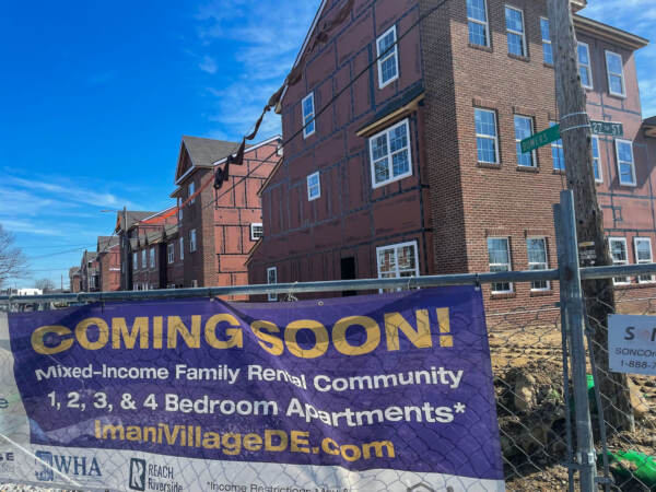 A home is seen under construction with a sign that reads, ''Coming soon!''