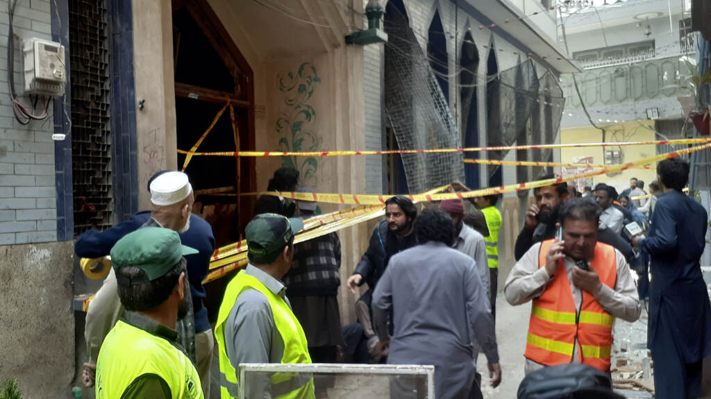 Pakistan Explosion Rescue workers and volunteers gather at the site of a bomb explosio