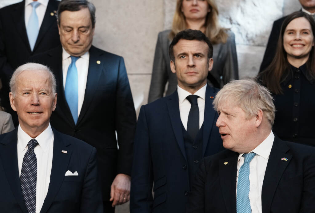 Belgium Russia Ukraine War Summit British Prime Minister Boris Johnson, front right, looks toward U.S. President Joe Biden, front left, at a group photo during a NATO summit at NATO headquarters in Brussels