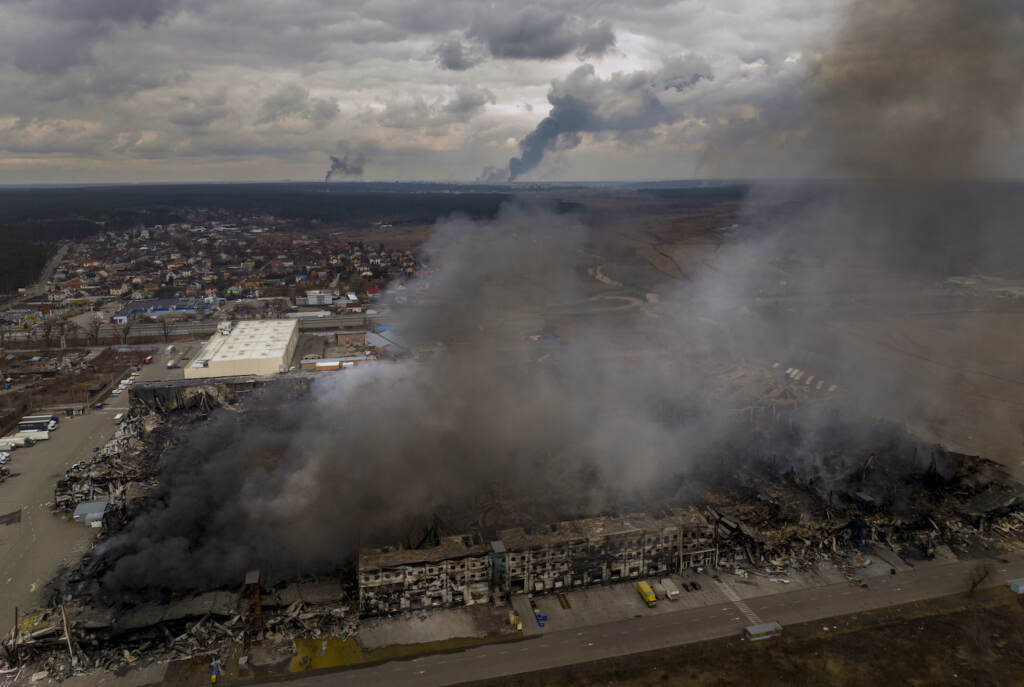 APTOPIX Russia Ukraine War A factory and a store are burning after being bombarded in Irpin