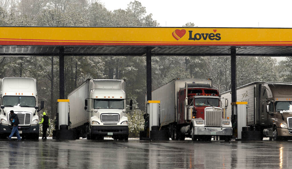 Biden Heavy Trucks FILE - In this Feb. 11, 2014, file photo, truck drivers stop at a gas station in Emerson, Ga., north of metro Atlanta, to fill up their tractor trailer rigs. A new government rule being announced by the Federal Motor Carrier Safety Administration on Thursday, Dec. 10, 2015, requires an estimated 3 million commercial truck and bus drivers to electronically record their hours behind the wheel in an effort to enforce regulations to prevent fatigue. (AP Photo/David Tulis, File)