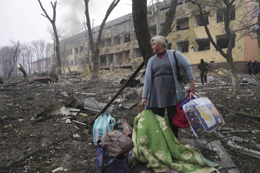 Russia Ukraine War The Month in Review A woman walks outside a maternity hospital that was damaged by shelling in Mariupol