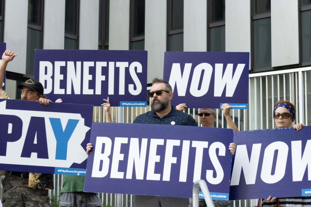 unemployment-employment-job-jobless-benefits-coronavirus-rally-payment-1920×1280 Demonstrators at a rally last year about the state's unemployment backlog. (Ashton Jones / 90.5 WESA)