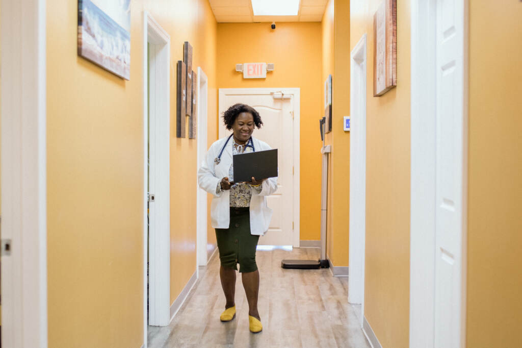 Nadiya Julien walks down the hallway of the clinic
