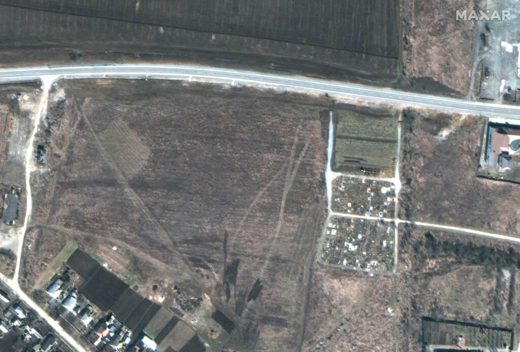 March 19, 2022: an overview of a cemetery and the early expansion of graves. March 19, 2022: an overview of a cemetery and the early expansion of graves.
(Satellite image ©2022 Maxar Technologies)