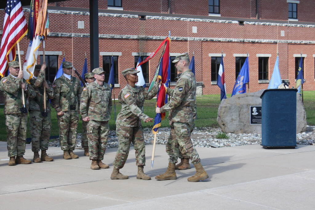 2022 04 08-kburns-changing of command of 99th readiness division army reserves based at joint base mdl new jersey Maj. Gen. Rodney Faulk, commanding general of the Army Reserve's 99th Readiness Division based at Joint Base McGuire-Dix-Lakehurst, passing the colors to Command Sgt. Maj. Subretta Pompey as she assumes the assignment as the top non-commissioned officer in the division. She is also the first African American and first woman to hold that position.