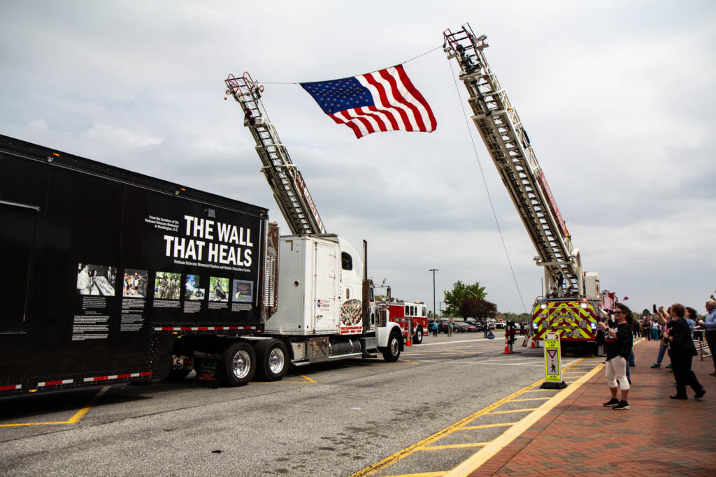 2022 04 26 kpaynter the wall that heals vietnam war-4 Students and teachers cheer as The Wall That Heals arrives at William Penn High School in New Castle, Del., on April 26, 2022. (Kimberly Paynter/WHYY)