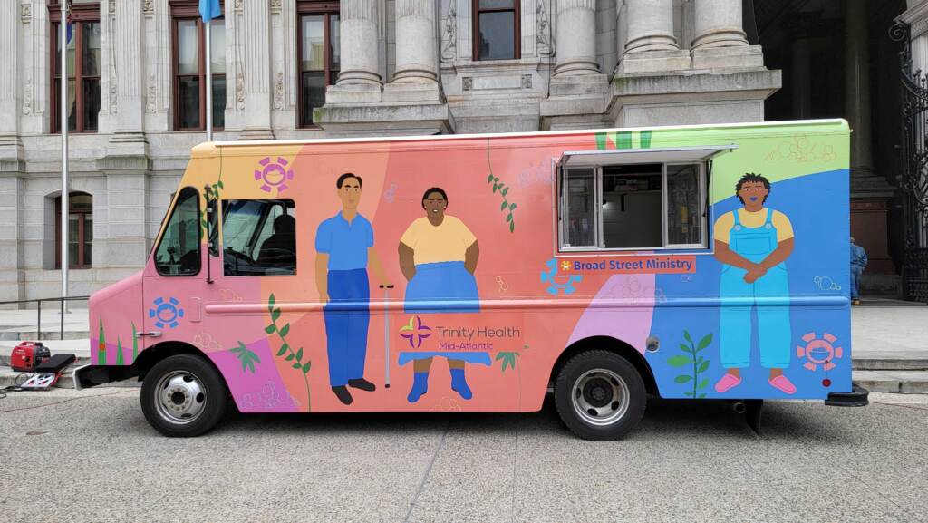20220405_131035 The hygiene truck, brightly colored, sits outside City Hall.