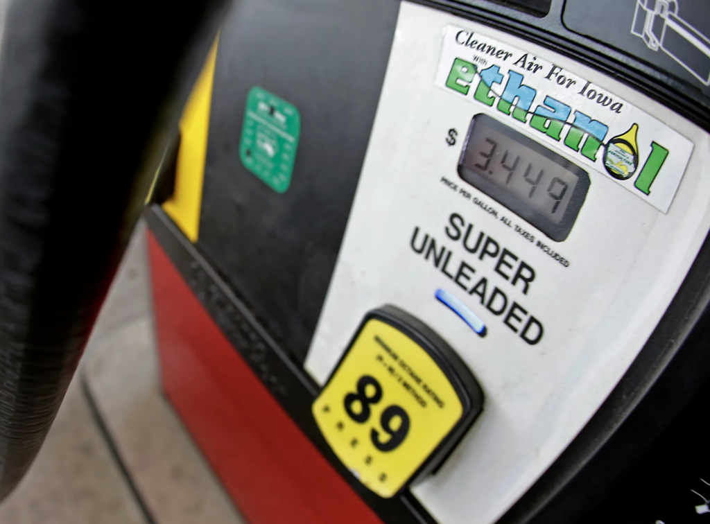 20220412Charlie Riedel-AP file photo-gasoline-pump-gas-prices A motorist fills up with gasoline containing ethanol in Des Moines, Iowa. President Biden will announce today that he will lift the summer restriction on gasoline containing the E15 ethanol blend. (Charlie Riedel/AP file photo)