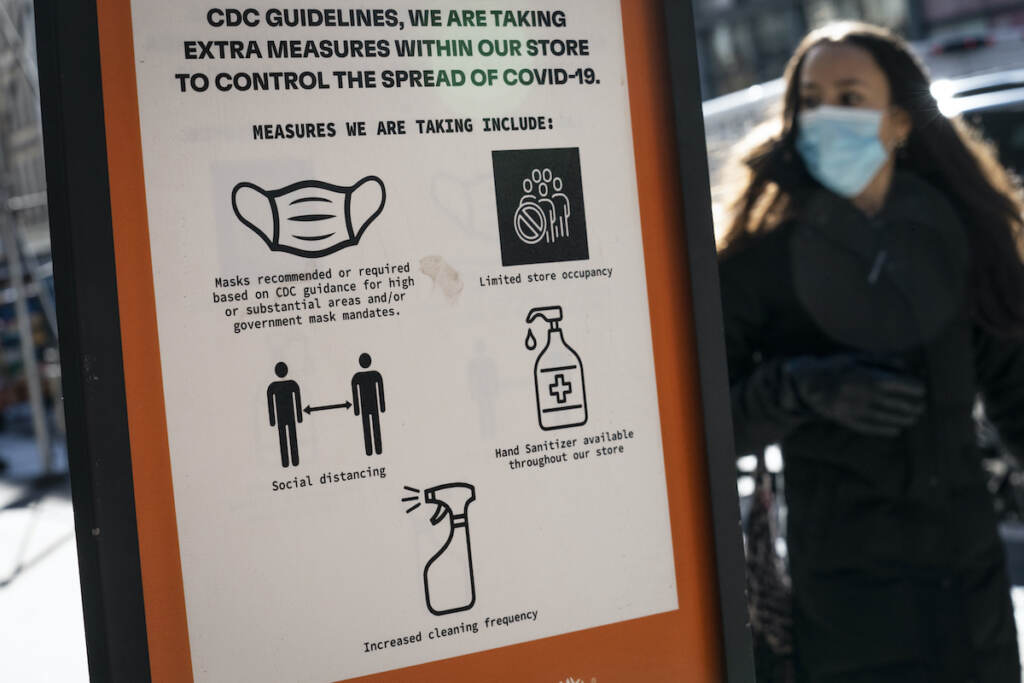 Virus Outbreak New York Pedestrians wearing protective masks walk along Broadway in the SoHo district of New York City, Friday, March 4, 2022, in New York. Mayor Eric Adams announced in a morning news conference that the city will be scaling back of COVID-19 mask and vaccine mandates