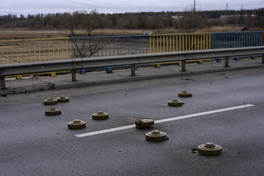 Russia Ukraine War Anti tank mines are displayed on a bridge in Bucha, in the outskirts of Kyiv, Ukraine, Saturday, April 2, 2022. (AP Photo/Rodrigo Abd)