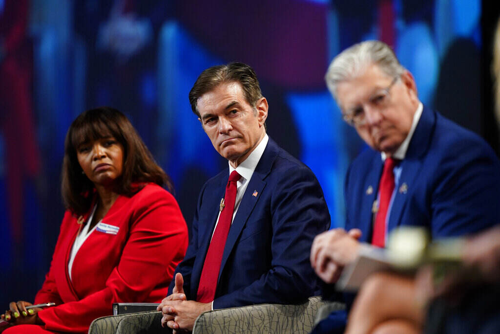 Election 2022 Pennsylvania Senate Kathy Barnette, left, Mehmet Oz, and George Bochetto take part in a forum for Republican candidates for U.S. Senate in Pennsylvania at the Pennsylvania Leadership Conference in Camp Hill, Pa., Saturday, April 2, 2022. (AP Photo/Matt Rourke)