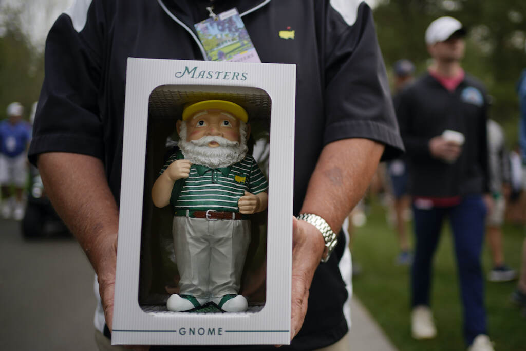 Masters Golf Dan Szatkowski, North Augusta, S.C, poses with his newly purchased garden gnome during a practice round for the Masters golf tournament on Tuesday, April 5, 2022, in Augusta, Ga. (AP Photo/Robert F. Bukaty)