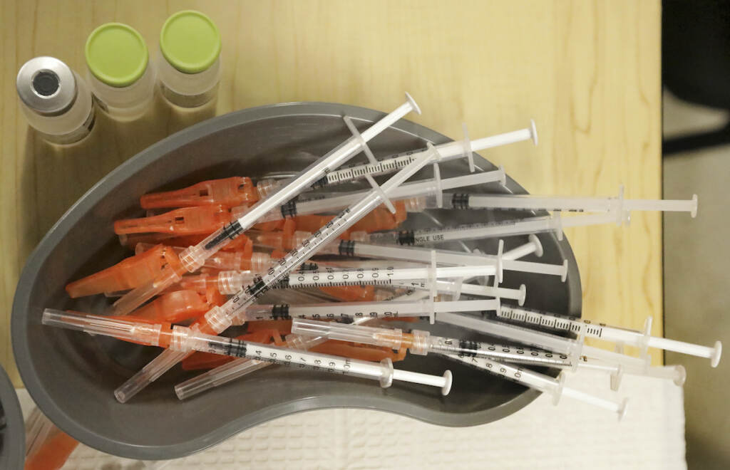 Virus Outbreak-Vaccines File photo: Medical personnel place pre-loaded syringes as they vaccinate students at KIPP Believe Charter School in New Orleans, Jan. 25, 2022. While many Americans are trying to move on with their lives after two years of the coronavirus pandemic, U.S. health officials are only beginning to decide on a strategy for using the COVID-19 vaccines to stay ahead of the outbreak. A panel of vaccine experts is meeting Wednesday, April 6, 2022 to discuss key questions for future COVID-19 booster campaigns, including how often the shots should be updated against new viral strains and who should get them