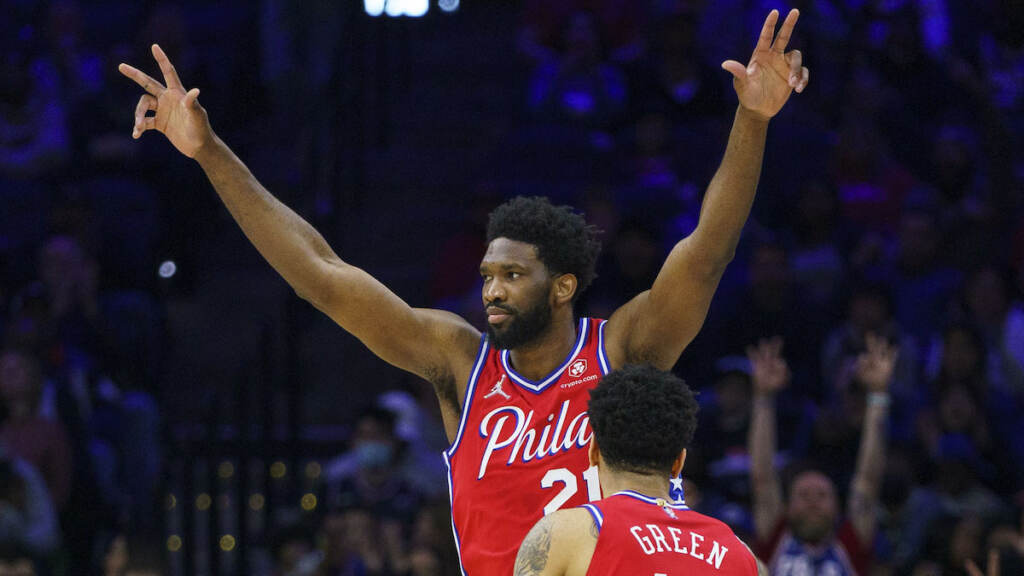 Pacers 76ers Basketball Philadelphia 76ers' Joel Embiid (left) reacts to the basket by Danny Green, during the first half of an NBA basketball game against the Indiana Pacers, Saturday, April 9, 2022, in Philadelphia. (AP Photo/Chris Szagola)