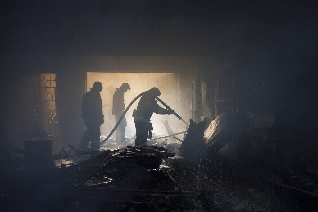 Russia Ukraine War Firefighters work to extinguish a fire at a house after a Russian attack in Kharkiv, Ukraine, Monday, April 11, 2022.