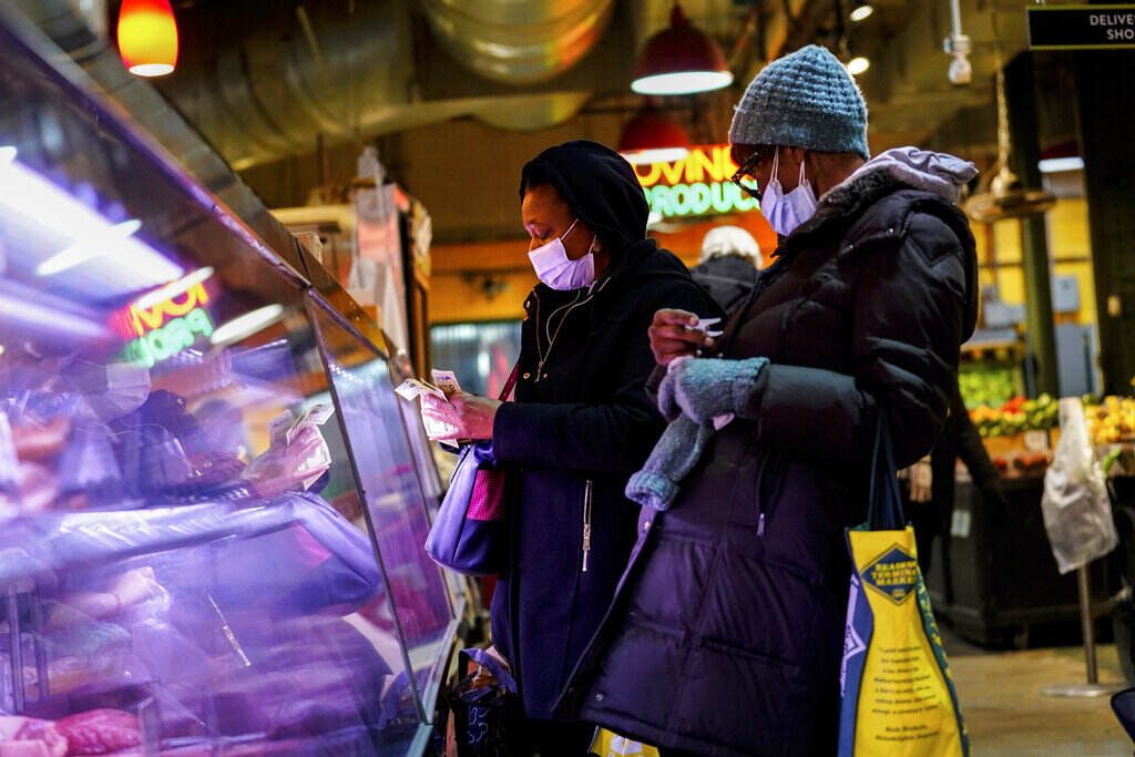 Virus Outbreak Customers wearing face masks at Reading Terminal Market.