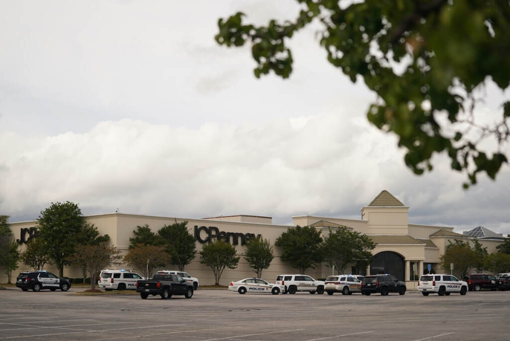 Authorities stage in a parking lot at Columbiana Centre mall in Columbia, S.C., following a shooting, Saturday, April 16, 2022. (AP Photo/Sean Rayford)