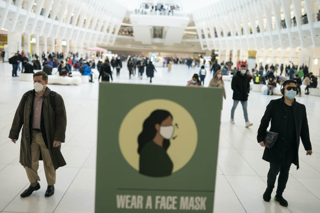 Mass transit riders wear masks as they commute in the financial district of lower Manhattan, Tuesday, April 19, 2022, in New York. U.S. District Judge Kathryn Kimball Mizelle in Tampa, Fla., on April 18, 2022, voided the national travel mask mandate as exceeding the authority of U.S. health officials. The mask mandate that covers travel on airplanes and other public transportation was recently extended by President Joe Biden's administration until May 3