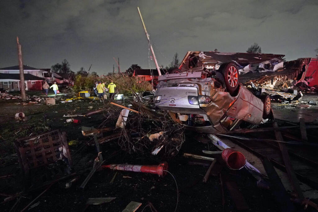 Climate UN Disaster Report A car is flipped over after a tornado tore through the area in Arabi, La., Tuesday, March 22, 2022. A tornado tore through parts of New Orleans and its suburbs Tuesday night, ripping down power lines and scattering debris in a part of the city that had been heavily damaged by Hurricane Katrina 17 years ago. (AP Photo/Gerald Herbert)