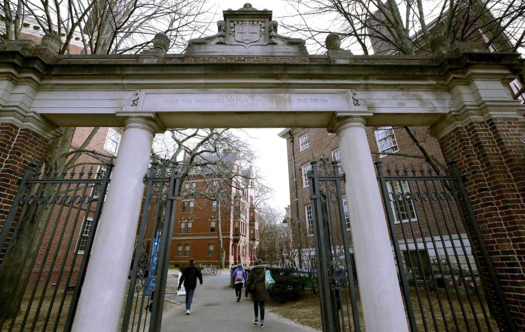 Harvard Slavery FILE - In this Dec. 13, 2018, file photo, a gate opens to the Harvard University campus in Cambridge, Mass. Harvard President Lawrence Bacow announced Tuesday, April 26, 2022 that the university is committing $100 million to study its ties to slavery and create a