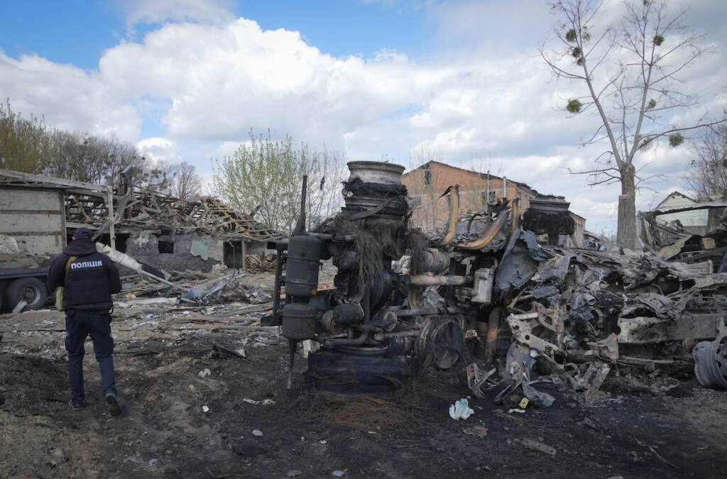 Russia Ukraine War A police officer inspects a destroyed area following a Russian missiles attack on Thursday in Fastov, south of Kyiv, Ukraine, Friday, April 29, 2022. (AP Photo/Efrem Lukatsky)