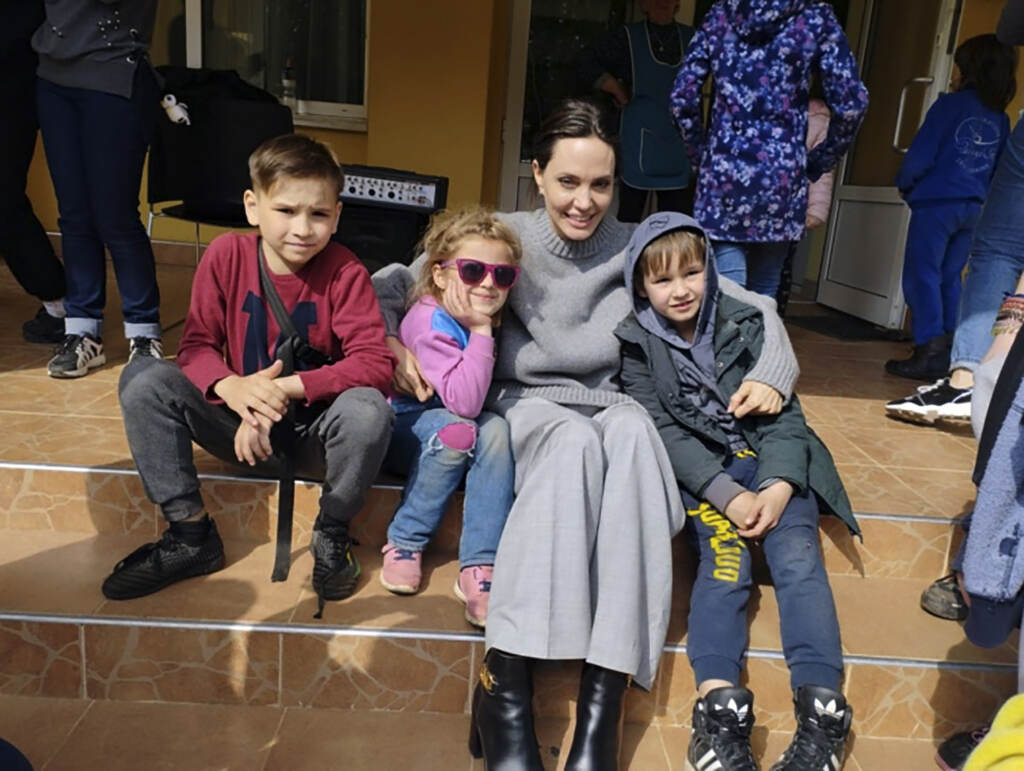 APTOPIX Russia Ukraine War In this image provided by the Lviv city hall Angelina Jolie, Hollywood movie star and UNHCR goodwill ambassador, poses for photo with kids in Lviv, Ukraine, Saturday, Apr. 30, 2022. Ms Jolie was in Ukraine to meet the children affected by the war and visited hospitals and NGOs helping the injured and displaced