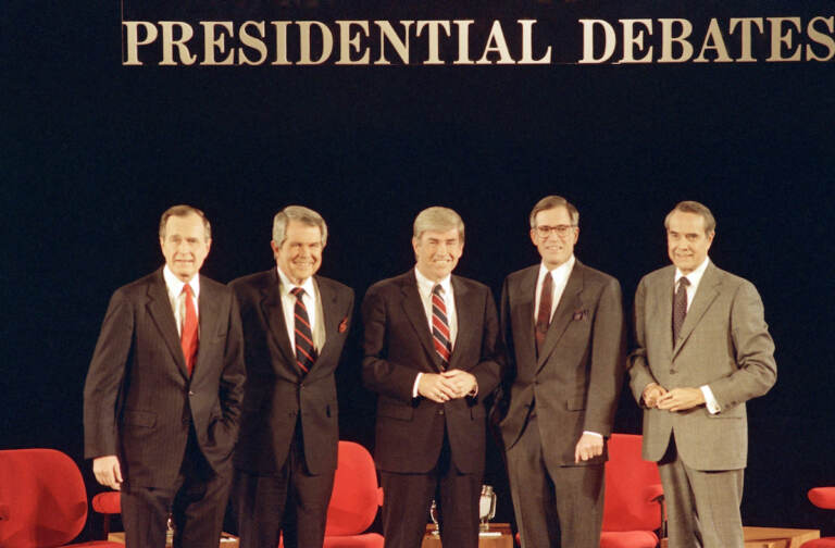 File photo: Republican presidential candidates pose before starting their debate on Sunday, Feb. 14, 1988 in Goffstown, New Hampshire. From left are Vice President George Bush, Pat Robertson, Rep. Jack Kemp, Pierre ''Pete'' du Pont and Senator Bob Dole. (AP Photo/Jim Cole)