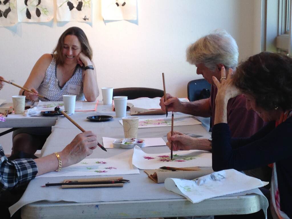 ARTZ Care Partners MLAC 2015 People are gathered around a table with art supplies.
