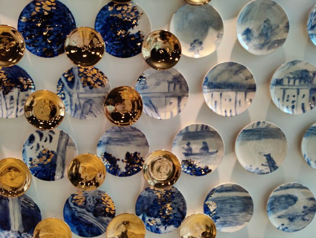 IMG_20220406_153719 The inaugural exhibition, ''Making Place Matter,'' opens on April 23. It will feature this wall installation of plates by Molly Hatch, inspired by a painting of rowers on the Schuylkill River, at the Philadelphia Museum of Art. (Peter Crimmins/WHYY)