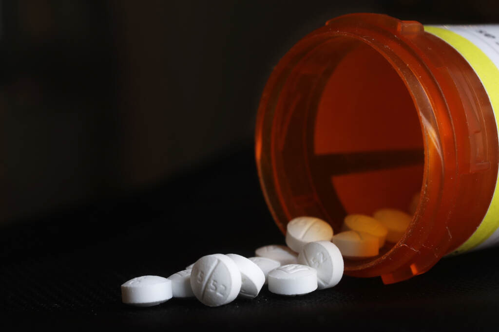 File photo: This photo shows an arrangement of Oxycodone pills. (AP Photo/Mark Lennihan, File)