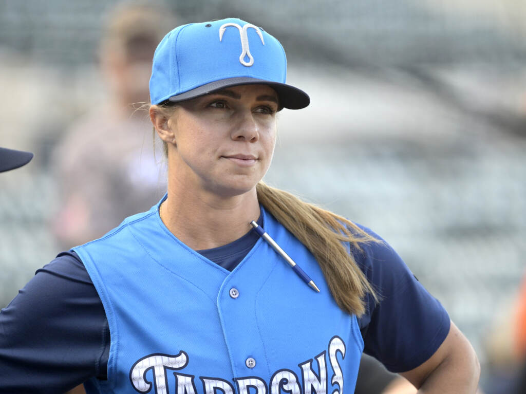 Tampa Tarpons manager Rachel Balkovec watches from the top steps of the dugout, while making her debut as a minor league manager of the Tampa Tarpons on Friday in Lakeland, Fla. Tampa Tarpons manager Rachel Balkovec watches from the top steps of the dugout, while making her debut as a minor league manager of the Tarpons, a Single-A affiliate of the New York Yankees, before a baseball game against the Lakeland Flying Tigers, Friday, April 8, 2022, in Lakeland, Fla. Balkovec is the first female to manage a professional baseball team.