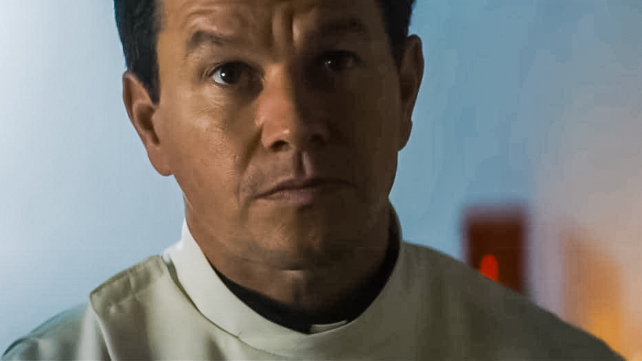 flicks-father-stu Close up of Mark Wahlberg wearing priests clothing