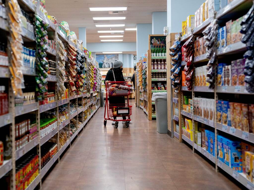 A shopper walks through a grocery store in Washington, D.C, on March 13. Surging inflation poses a particular challenge for working-class families, impacting the cost of basic necessities such as groceries. A shopper walks through a grocery store in Washington, D.C, on March 13. Surging inflation poses a particular challenge for working-class families, impacting the cost of basic necessities such as groceries. (Stefani Reynolds/AFP via Getty Images)
